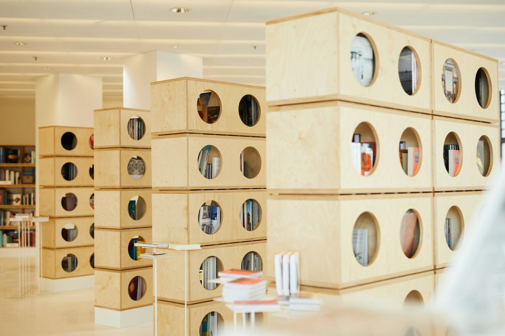 Round-shaped holes in bookshelves